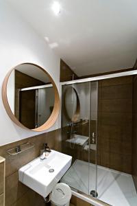 a bathroom with a sink and a mirror at Central 5 Guest House in Budapest