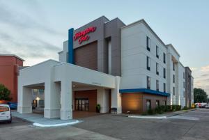 a building with a sign on the front of it at Hampton Inn Norfolk in Norfolk