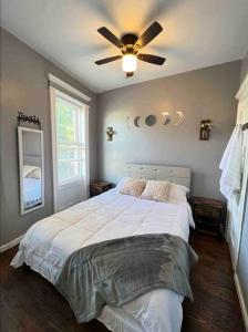 a bedroom with a bed with a ceiling fan at Stylish 1 Bedroom Apt - Brooklyn by train station in Brooklyn