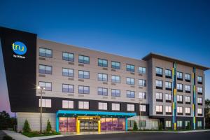 a large building with a hotel with a sign on it at Tru By Hilton Ashland, Va in Ashland