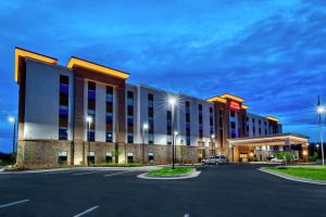 a hotel with a parking lot in front of it at Hampton Inn & Suites Culpeper in Culpeper