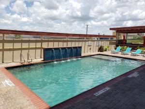 a large swimming pool on top of a building at Home2 Suites By Hilton Edinburg in Edinburg