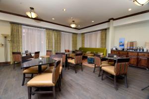 a dining room with tables and chairs at Hampton Inn & Suites Gallup in Gallup