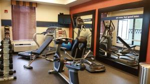 a gym with several tread machines in a room at Hampton Inn & Suites Gallup in Gallup