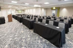 a conference room with rows of tables and chairs at Homewood Suites By Hilton Paducah in Paducah