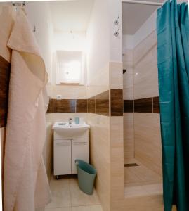 a bathroom with a sink and a shower at Dobré ráno in Banská Štiavnica