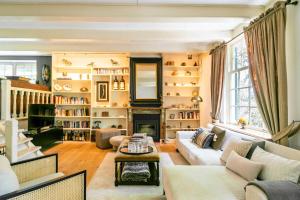 a living room with a couch and a fireplace at Filion's Place in Roosendaal