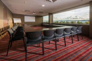 a conference room with a long table and chairs at Hampton By Hilton Bucaramanga in Bucaramanga +22 photos