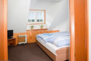 Postel nebo postele na pokoji v ubytování Pension Modrá Hvězda