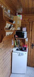 a kitchen with a counter in a wooden cabin at Ferienhaus Mentil in Greifenburg