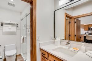 a bathroom with a sink and a mirror at Laurelwood Condominiums 211 in Snowmass Village +18 photos