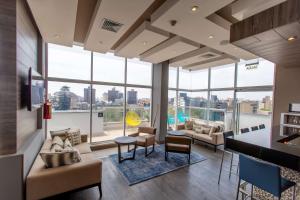 a living room with a view of a city at Hampton By Hilton Lima San Isidro in Lima