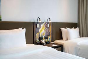 Cama ou camas em um quarto em Hampton By Hilton Lima San Isidro