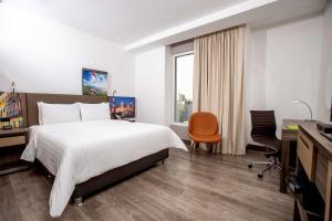 Cama ou camas em um quarto em Hampton By Hilton Lima San Isidro mais 29 fotos