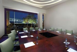 a large conference room with a long table and chairs at Hilton Garden Inn Monterrey Airport in Monterrey