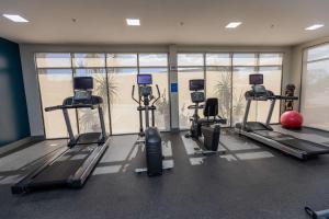 a gym with treadmills and exercise bikes in a room at Hampton By Hilton San Jose Airport Costa Rica in Alajuela