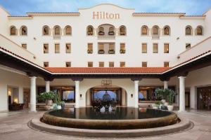 a hotel front with a large fountain in the courtyard at Hilton Grand Vacations Club La Pacifica Los Cabos in Cabo San Lucas