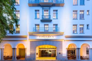 a white building with a sign for a boutique at Gran Hotel Costa Rica, Curio Collection By Hilton in San José