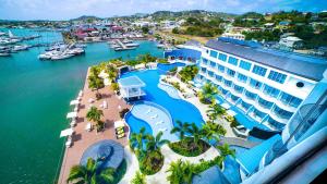 an aerial view of a resort with a marina at Harbor Club St Lucia, Curio Collection by Hilton in Gros Islet