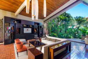 a living room with a couch and a table at Hilton Cariari DoubleTree San Jose - Costa Rica in San José