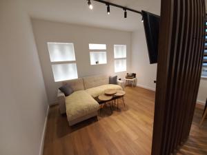 a living room with a couch and a table at Heart of Sarajevo - Baščaršija Private Garage in Sarajevo