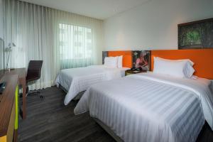 Ένα ή περισσότερα κρεβάτια σε δωμάτιο στο Hampton by Hilton Cali