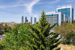 a christmas tree in front of a city at Charming Nuevo Madrid in Madrid