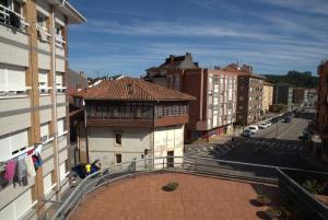 a view of a city street with buildings at ApartamentoLillos in Luanco