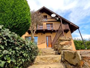 a house with a staircase leading up to it at Chata Vikinka - dovolená v přírodě 