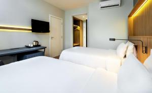 Hampton by Hilton Guarulhos Airport客房内的一张或多张床位