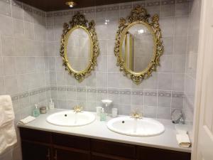 two sinks in a bathroom with mirrors on the wall at Tigh Na Bruach B&B in Invermoriston