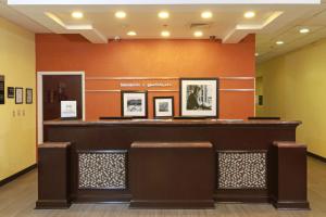 a lobby of a hotel with a bar and chairs at Hampton Inn by Hilton Guadalajara-Aeropuerto in Guadalajara +28 photos