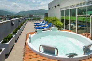 a hot tub on the roof of a building at Hampton By Hilton Yopal in Yopal