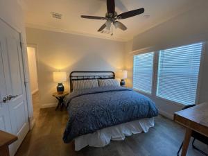 a bedroom with a bed and a ceiling fan at 3bed2bath With Creek And Open Spaces in Durango