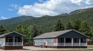 a building with a mountain in the background at 3bed2bath With Creek And Open Spaces in Durango