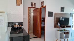 Kuchyň nebo kuchyňský kout v ubytování Casa com piscina e espaço gourmet a 30m da praia! + 7 fotografií