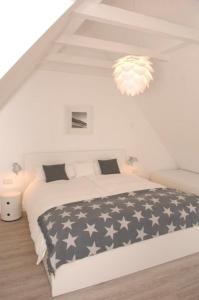 Postel nebo postele na pokoji v ubytování Haus Flora - Golden Knoepke