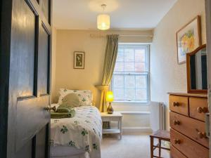 En eller flere senge i et værelse på Church End Cottage, Brampton