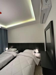 Posteľ alebo postele v izbe v ubytovaní modern 2bedroom for rent abdoun2