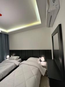 Kama o mga kama sa kuwarto sa Modern 2bedroom For Rent Abdoun2