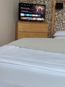 Postel nebo postele na pokoji v ubytování "TiMia" Nähe Europa Park und Rulantica Rust- Klima-Netflix