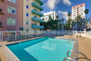 a swimming pool in front of a building at Ocean Views Penthouse 2b 2b Majestic Apartment 5 min to Convention Center in Long Beach