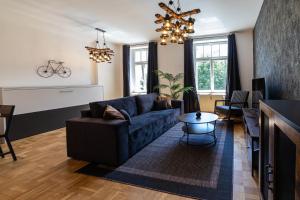 Posezení v ubytování L45 Premium Apartment "IndustriaI" bis zu 5 Personen