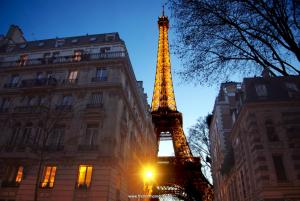 a view of the eiffel tower at night at Eiffel Tower 5 bedrooms 10 guests with 2 Carpark in Paris