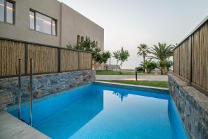 Bazén v ubytovaní KING MINOS RETREAT Resort & Spa alebo v jeho blízkosti