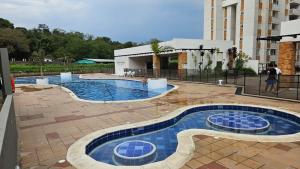 a swimming pool with blue tiles in a building at APARTAMENTO EN VILLETA in Villeta +8 photos