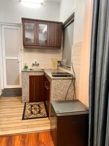 a small kitchen with a sink and a counter at Your home in Kathmandu! in Kathmandu