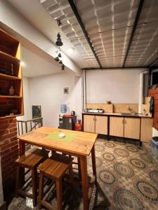 a kitchen with a table and chairs in a room at Your home in Kathmandu! in Kathmandu