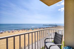 a balcony with a view of a beach at Inviting Virginia Beach Condo with Community Pool in Virginia Beach