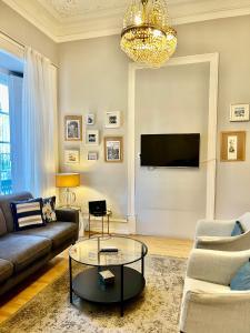 a living room with a couch and a table at Lisbon Guests Apartments in Lisbon